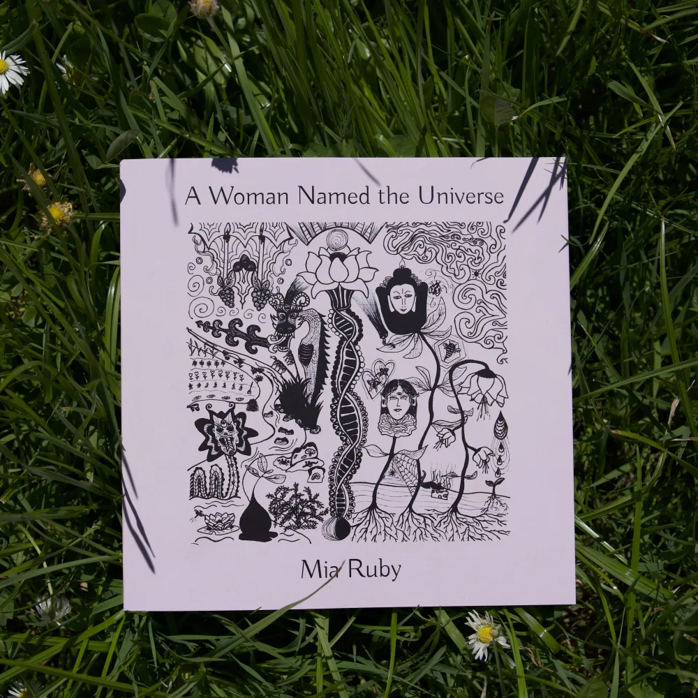 A Woman Named the Universe resting on the lawn